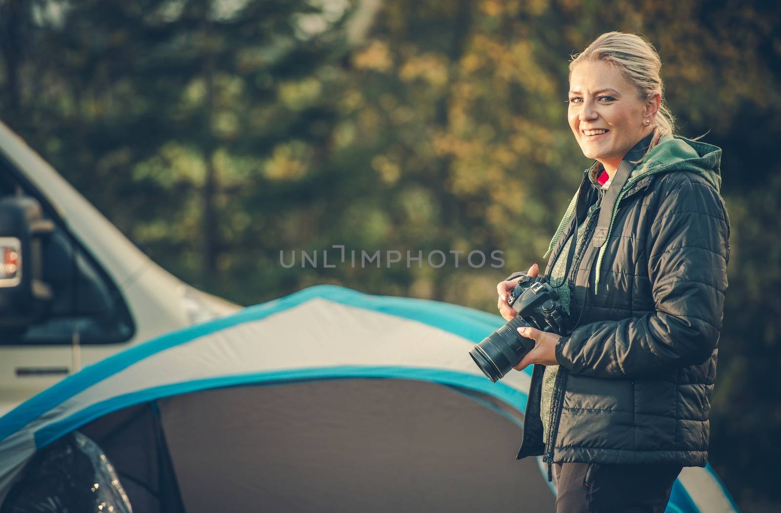 Female Photographer at Work. Woman with Modern Digital Camera Taking Outdoor Pictures