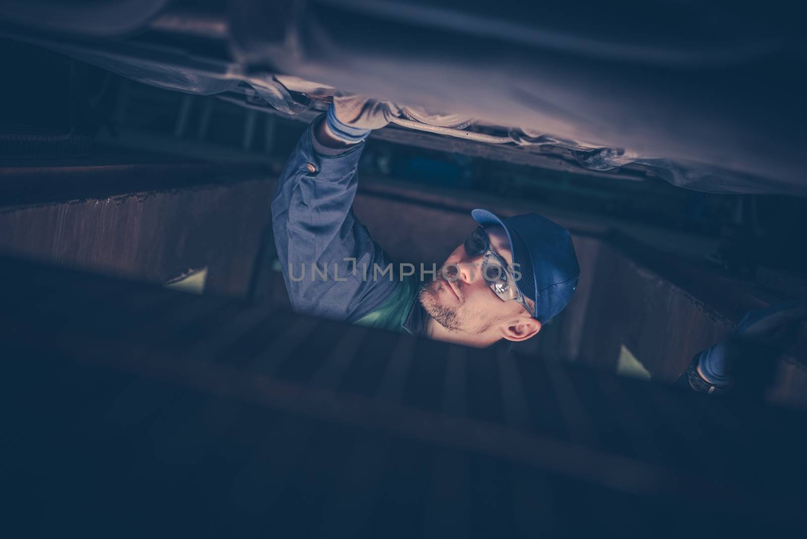 Mechanic Under the Car by welcomia