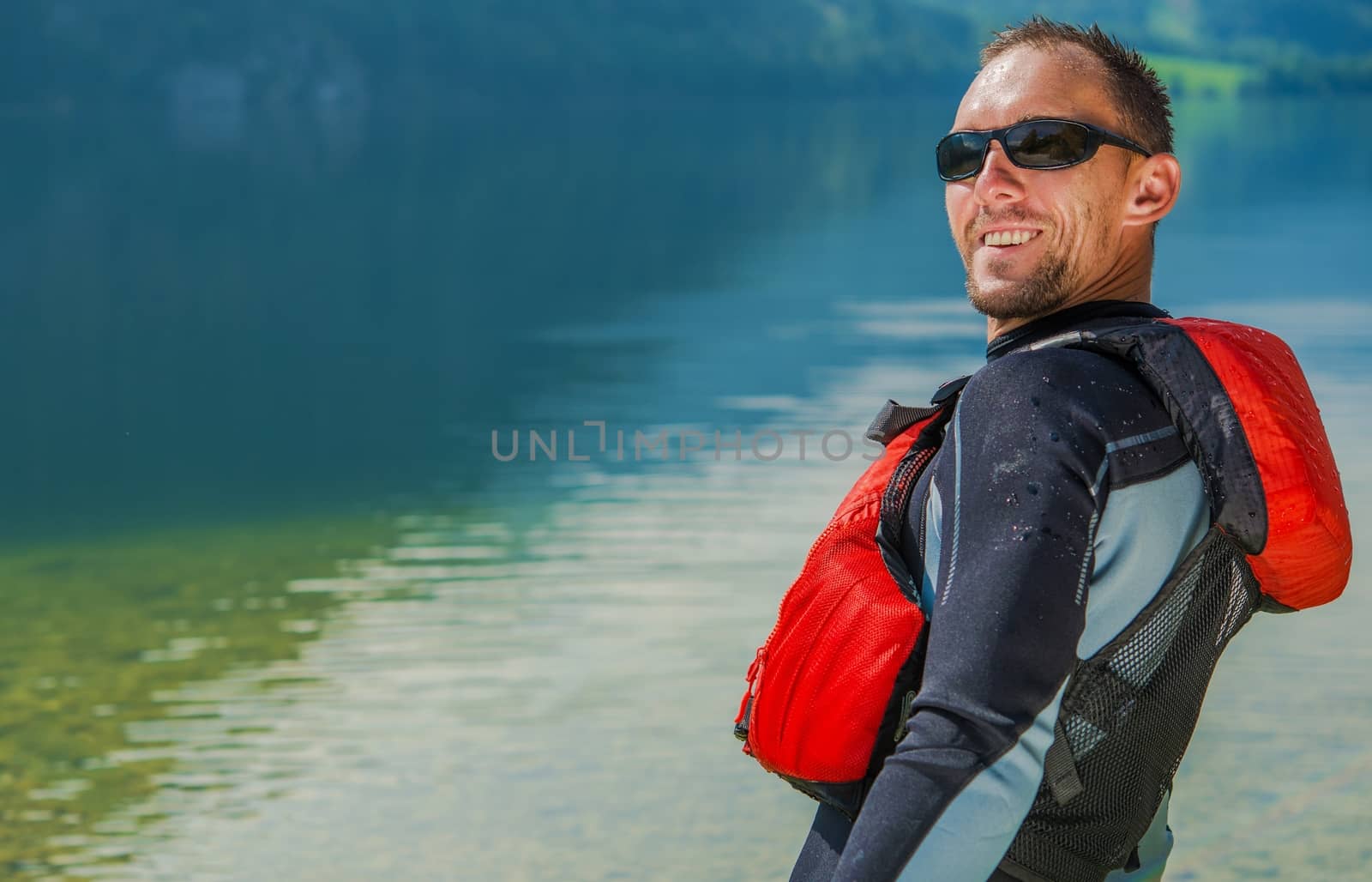 Happy Water Sportsman in Wetsuit. Summer Time Water Fun.