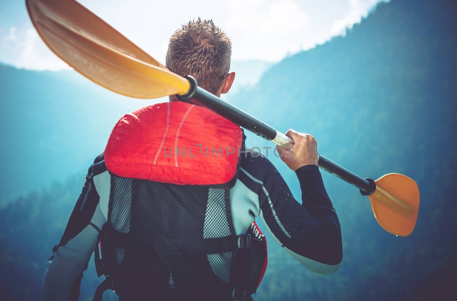 Kayak Trip Ready. Kayaker Preparing For Kayak Trip. Closeup Photo. Kayaker with Paddle.