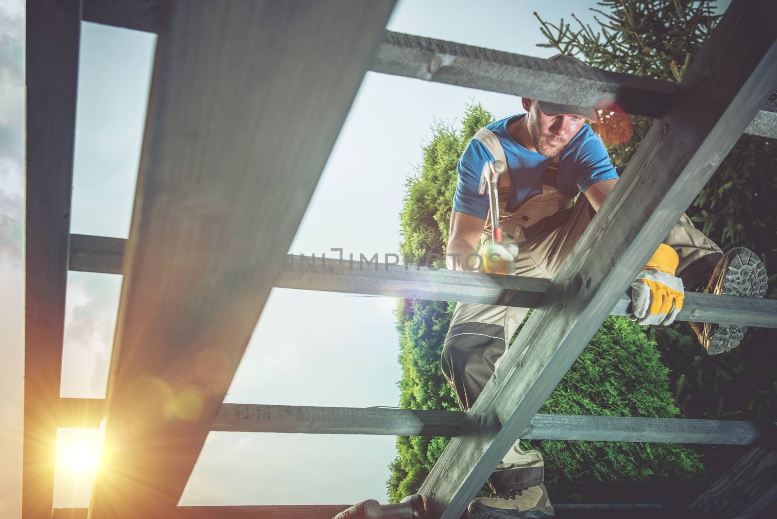 Pro Carpenter at Work. Wood Construction Job.