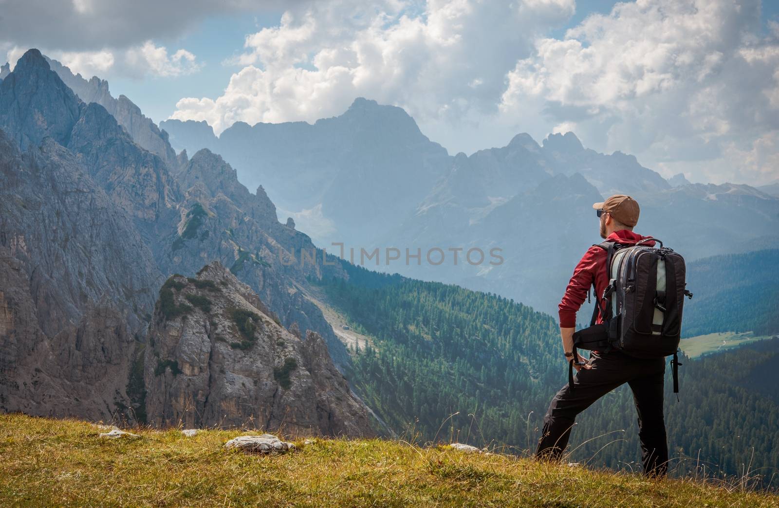 The Outdoor Men. Caucasian Hiker with Large Backpack Enjoying Scenic Trail.