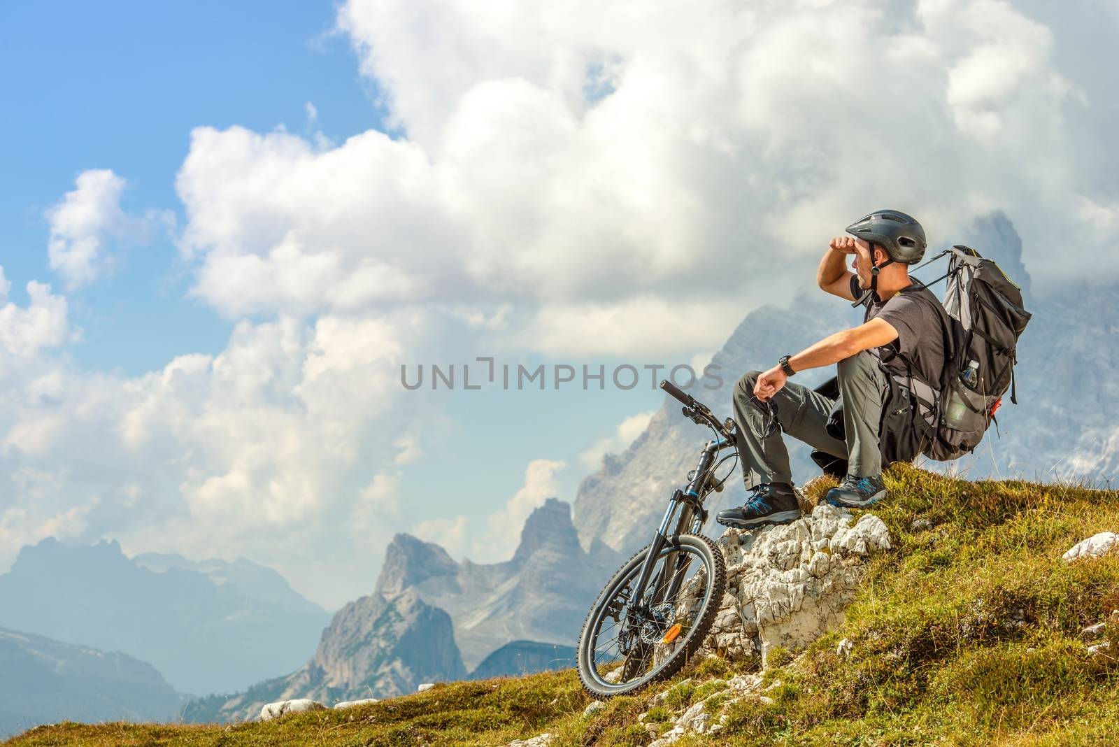 Mountain Biker Resting on the Mountain Trail. Biking Theme.