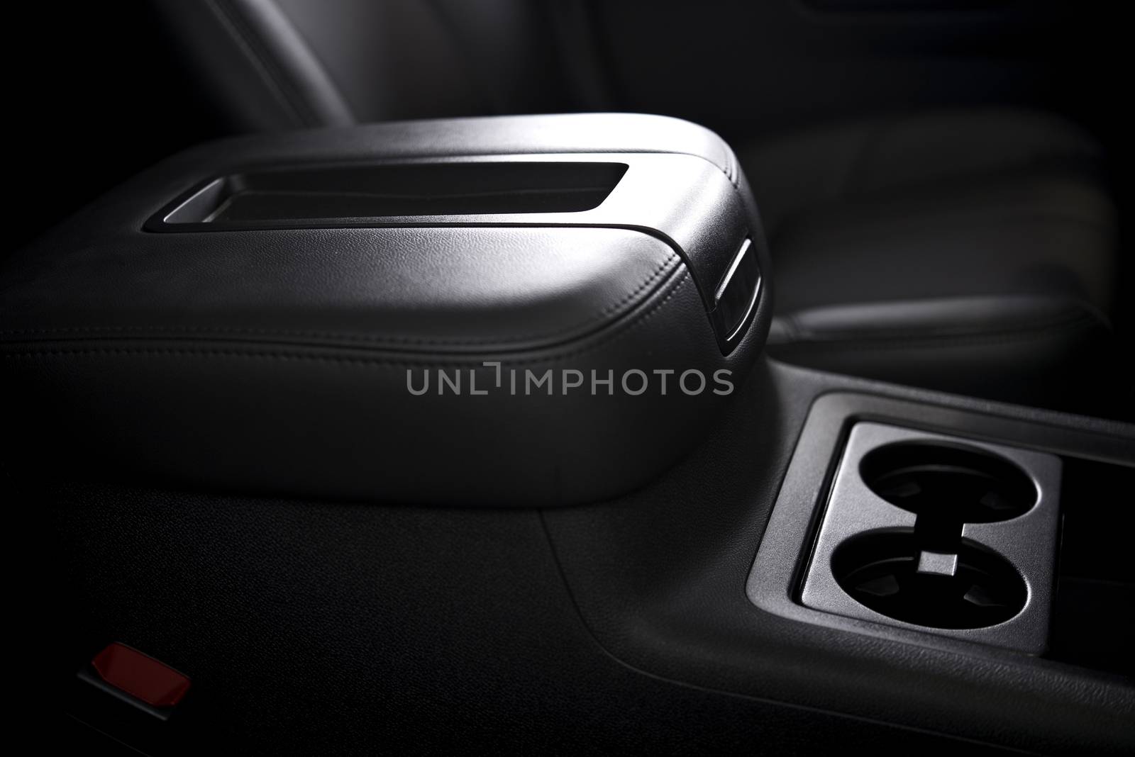 Clean Car Interior Closeup. Car Cup Holders and Arm Rest Details.