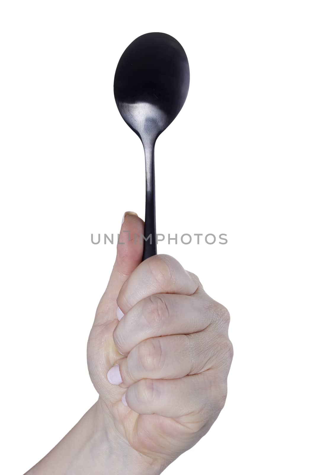 Female hand with a spoon on a white background