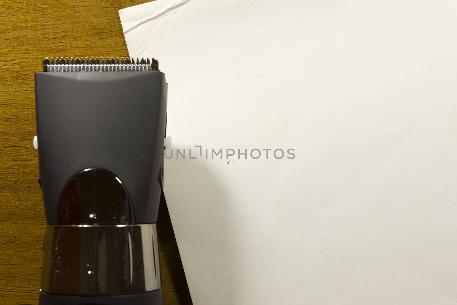 Hair clipper style on the wooden background