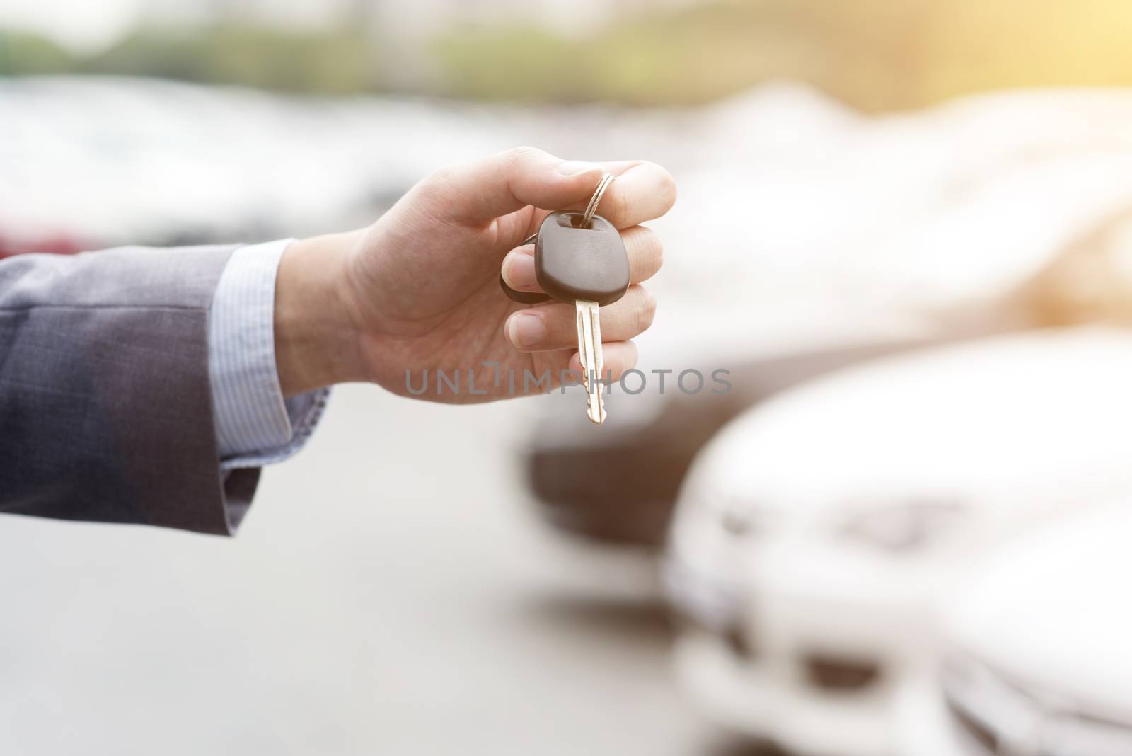 Hand with car key by szefei