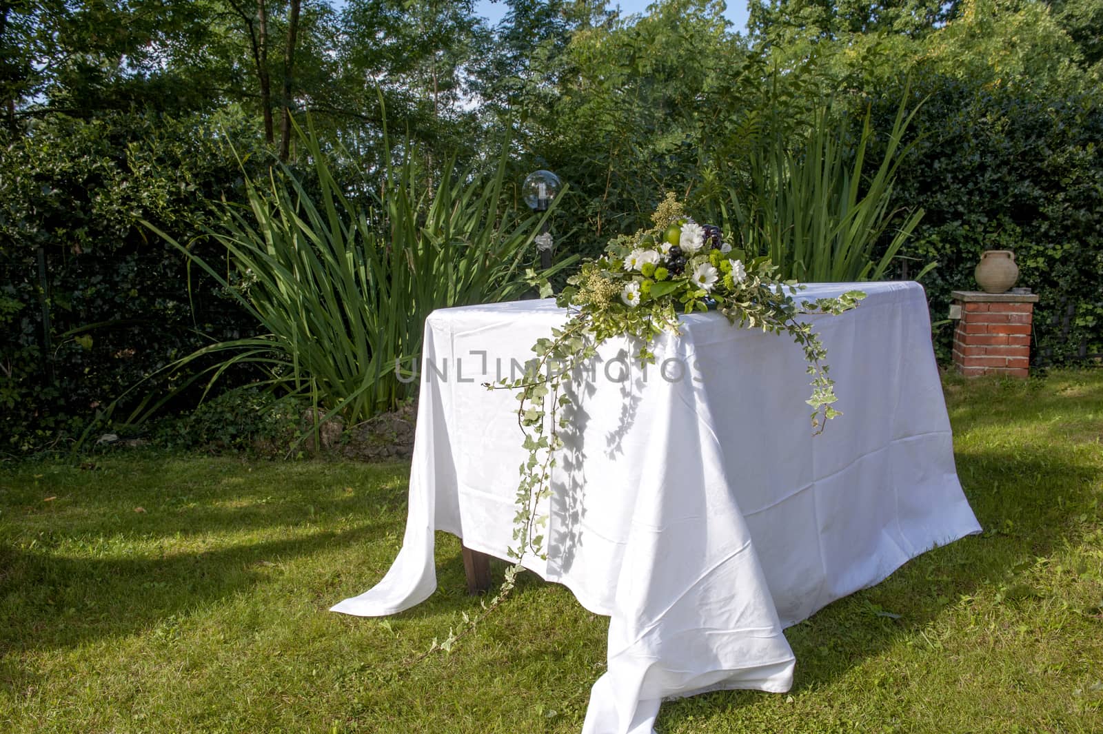 altar decorated with flowers for an outdoor wedding celebrated