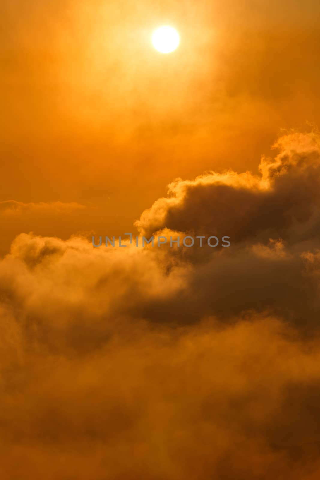 Sun over the clouds at sunrise