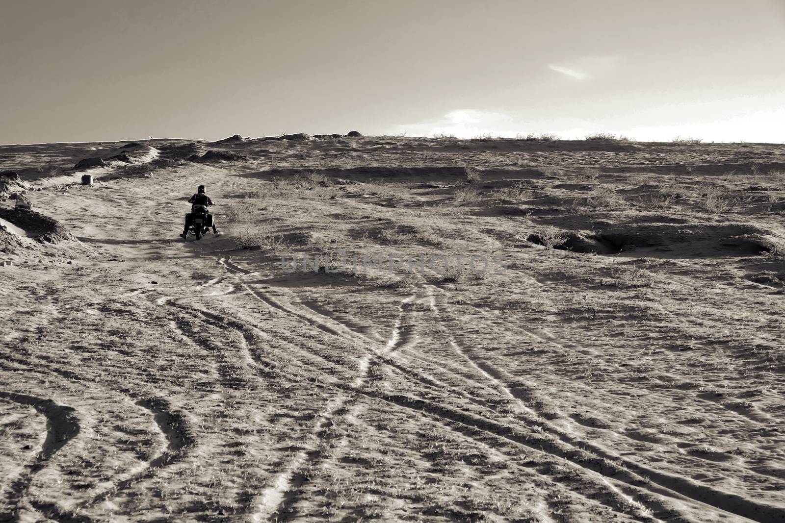 man ride motorbike on sand hill, adventure journey by xuanhuongho