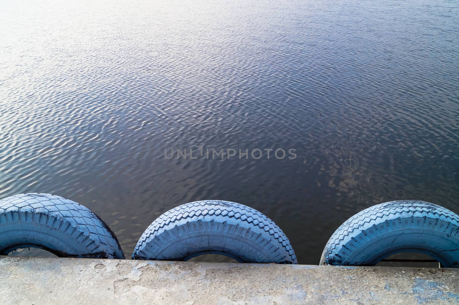 background water is a fence made of car tires