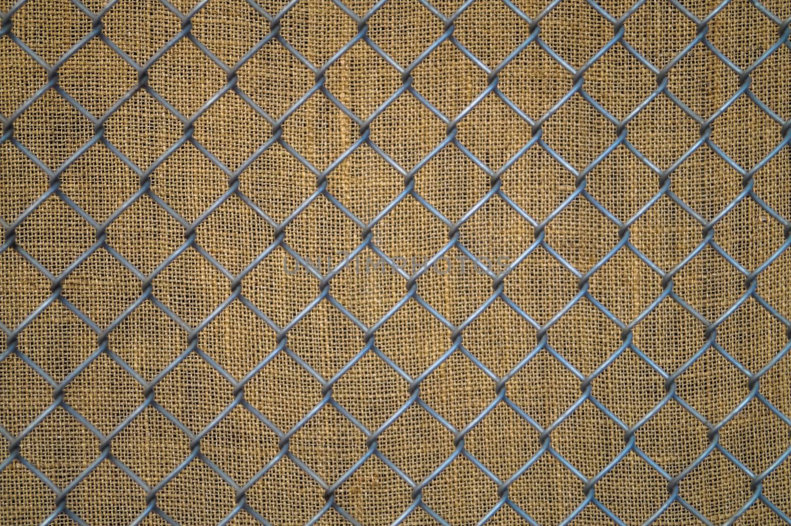 background of metal mesh on the old fabric