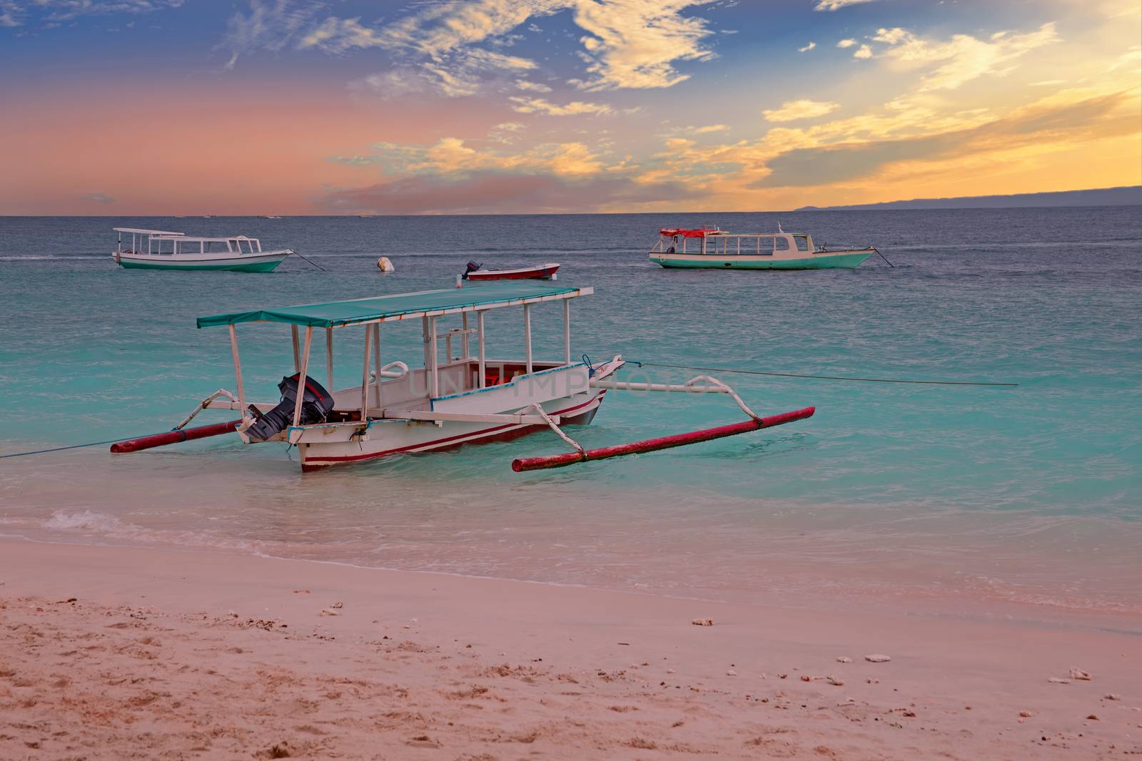 Traditional boat on Gili Meno island beach, Indonesia at sunset by devy