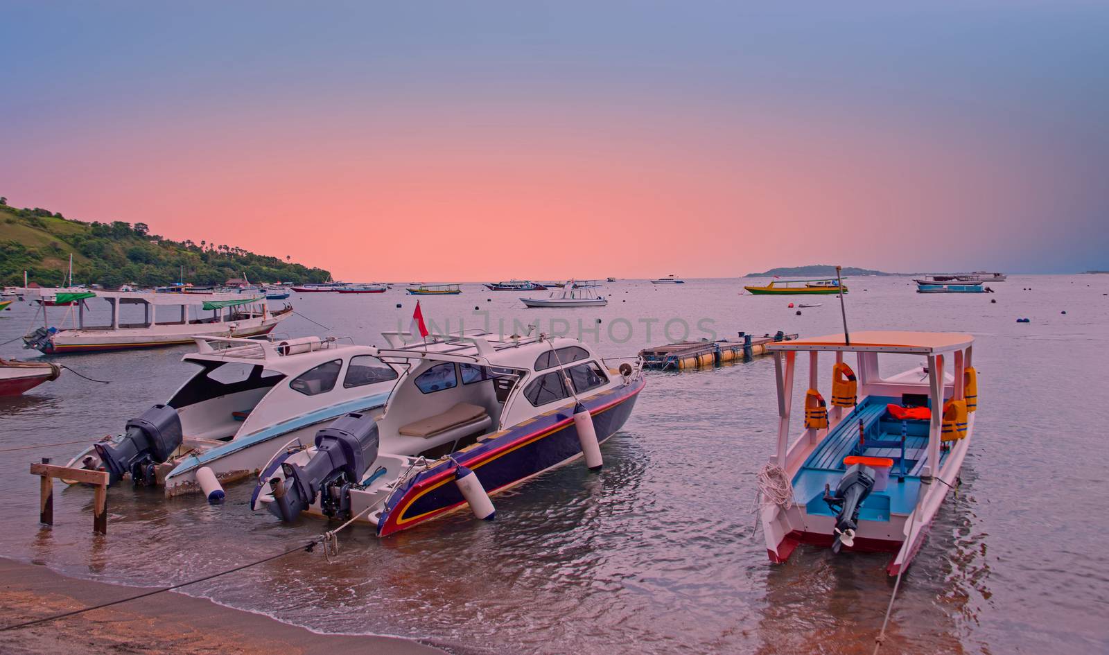 Boats on the beach at Gili Trawangan in Indonesia at sunset