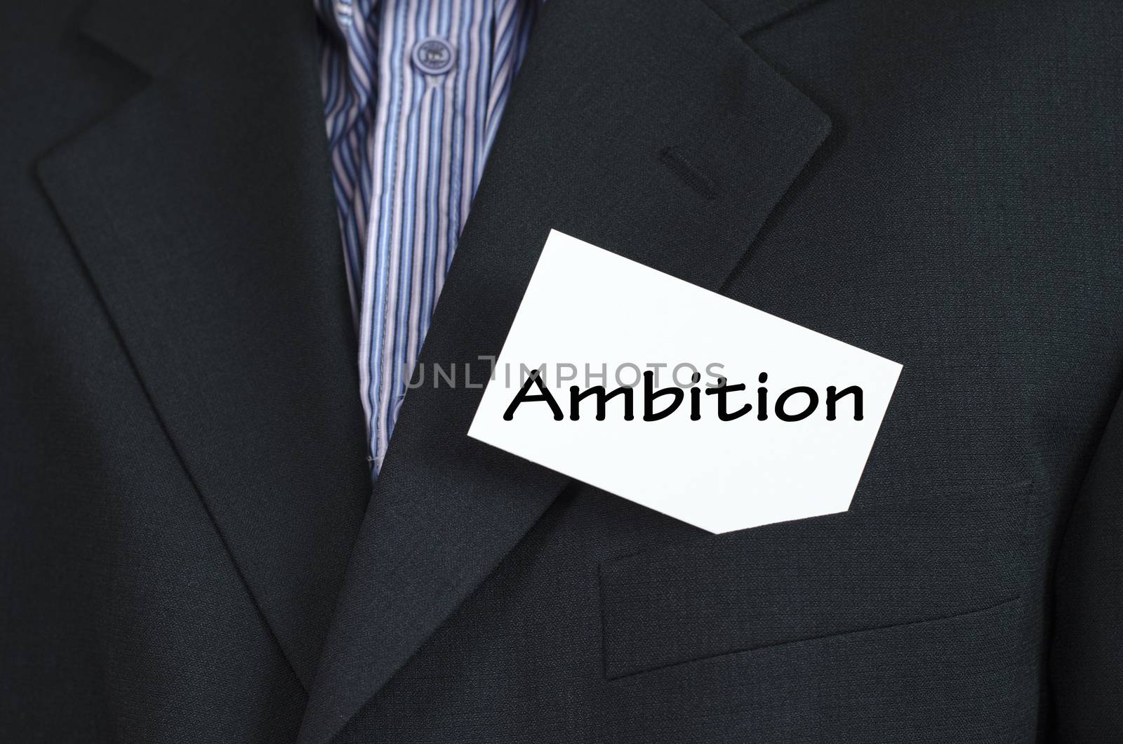 Ambition text note concept over business man background