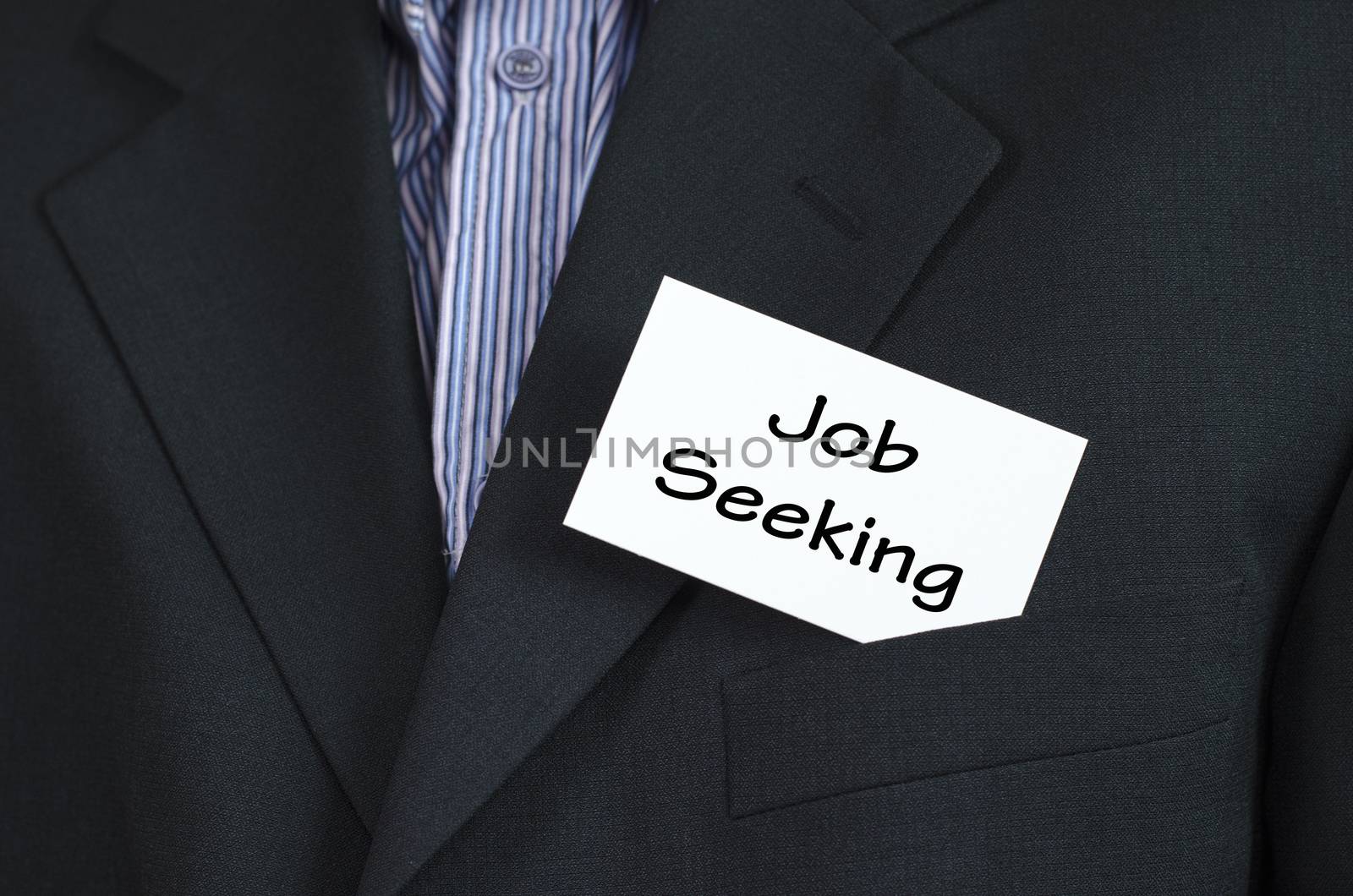 Job seeking text note concept over business man background