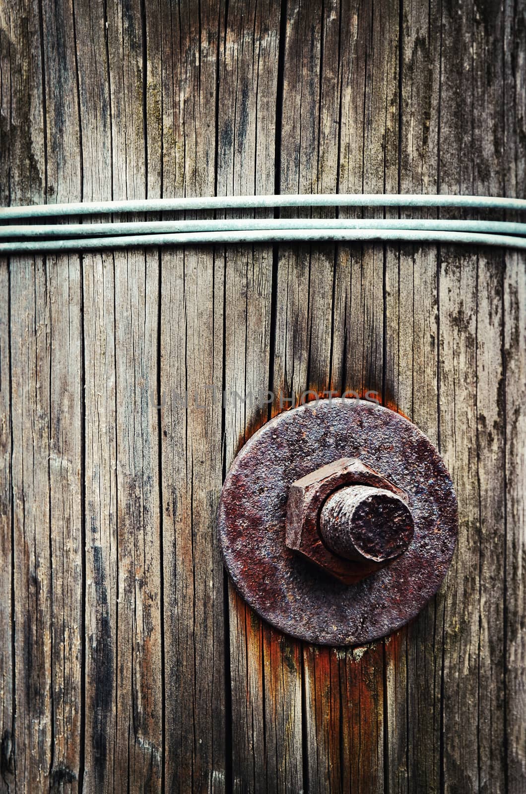 background screw attached to a wooden beam