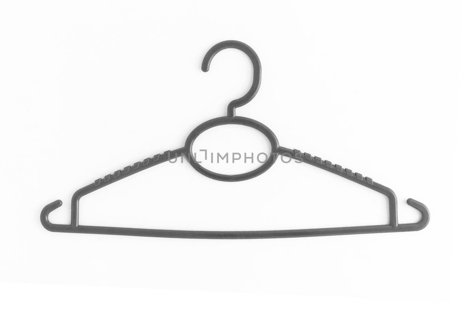 One colored plastic hanger, isolated on white background, close-up.