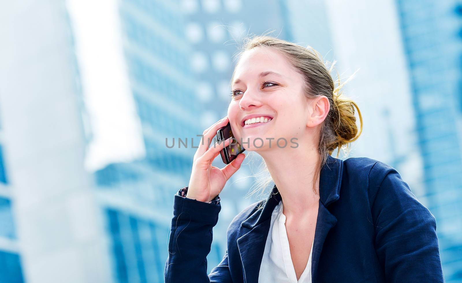 dynamic young executive calling outside, free of any constraint. Symbolizing a job search or a trade of outsourcing