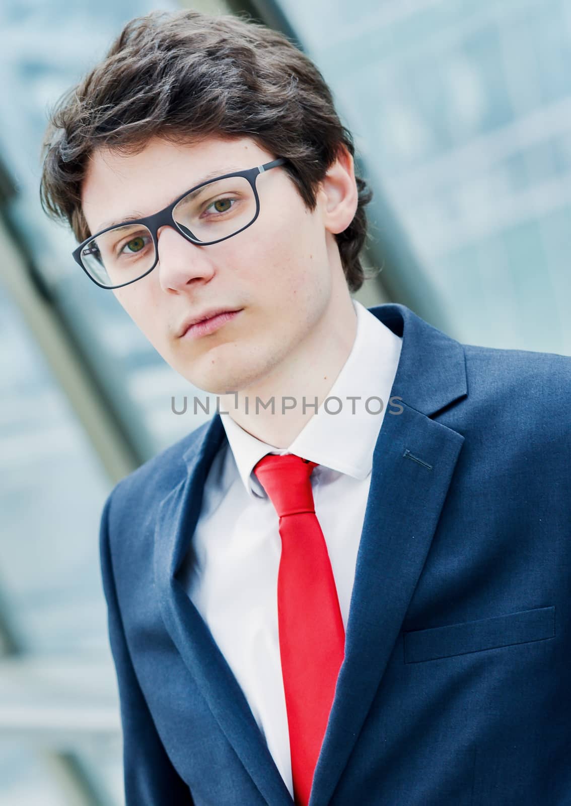 Portrait of a pensive worried businessman outside his office