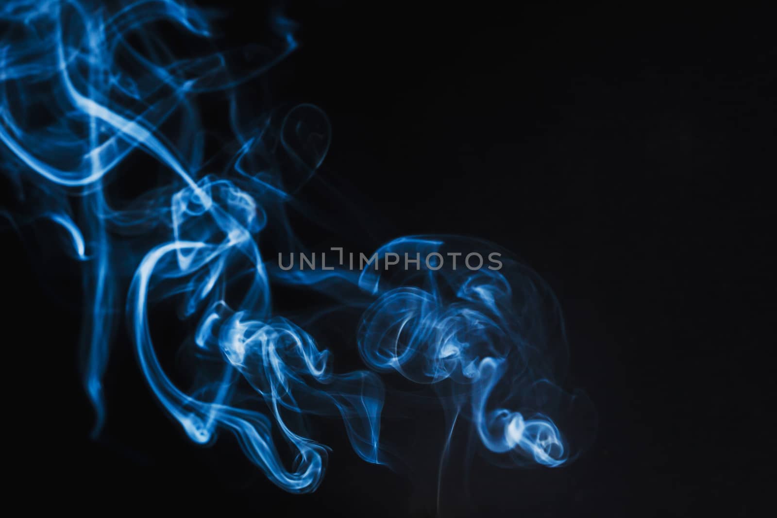 Abstract Blue Smoke on black background by nopparats