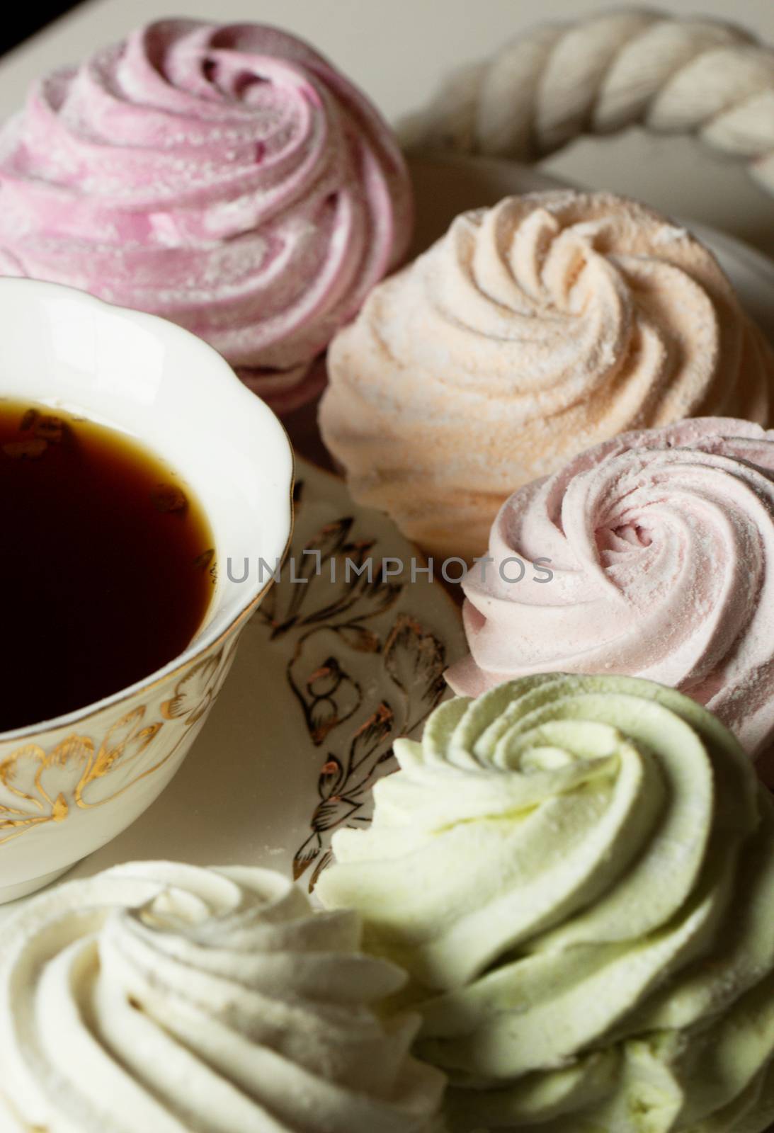 Sweet homemade dessert - marshmallow (zephyr) and cup of tea by kate_ovcharenko