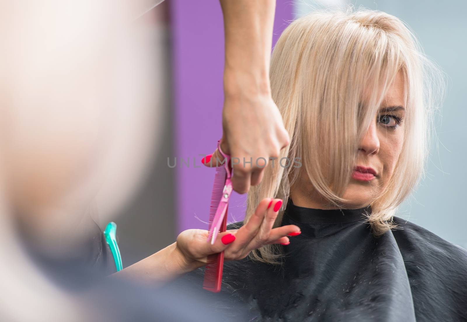 Blond Woman Getting Hair Cut by welcomia