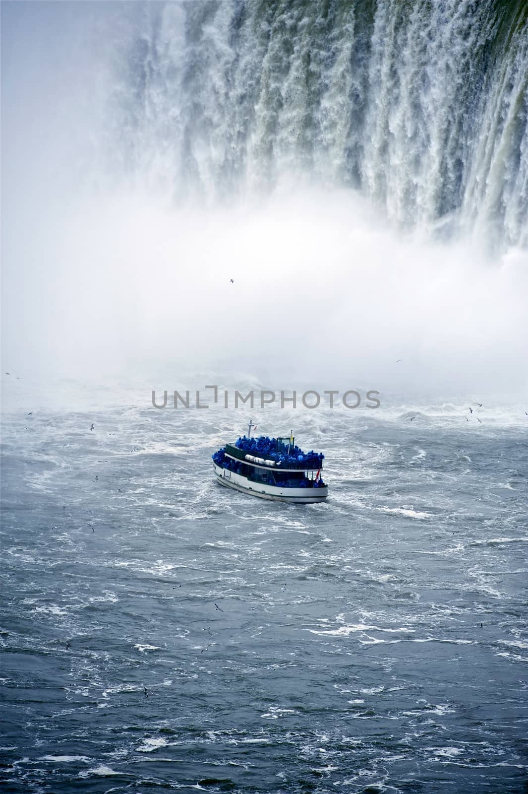 NIagara Turist Boat Tour. Canadian Niagara Falls. Ontario, Canada. Vertical Photo. Vertical Photography.