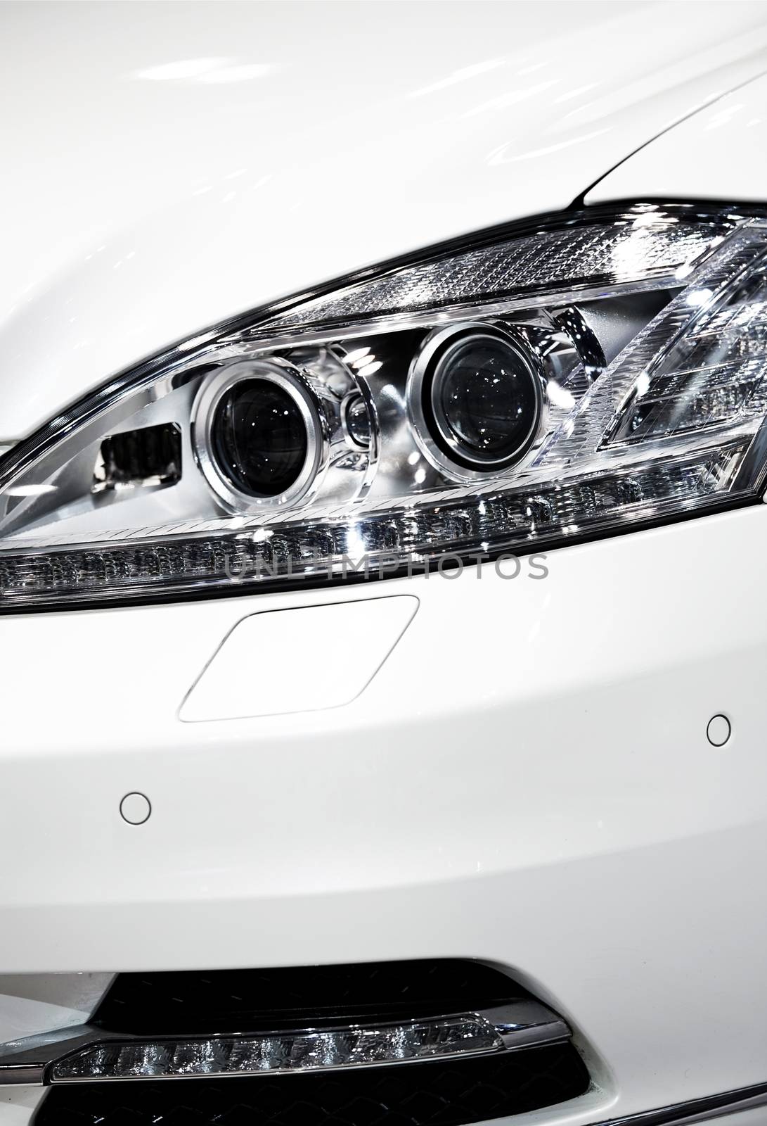 Modern Lens Car Headlight. Vehicle LED and Lens Lighting. Closeup