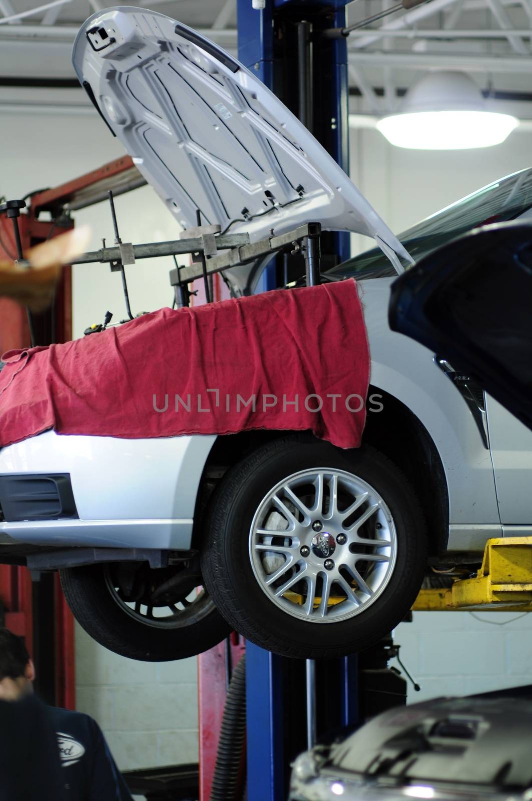 Auto Service. Repairing Vehicle in the Auto Service. Vertical Photo