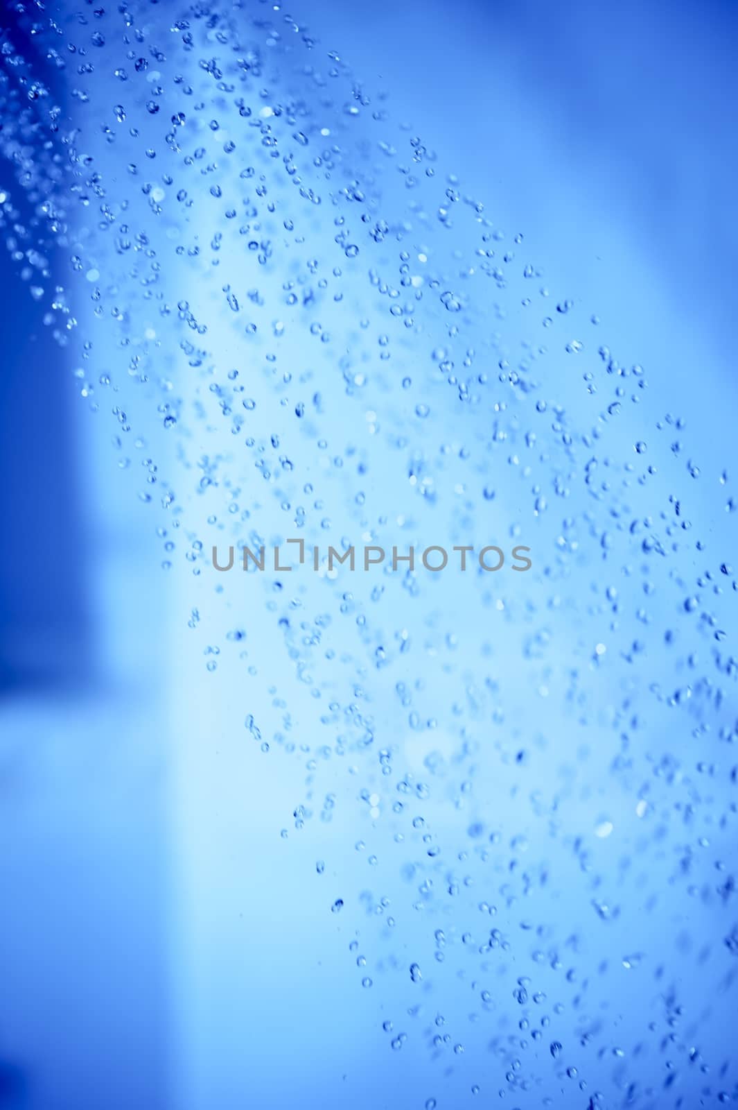 Shower Water Drops. Bathroom Refreshing Theme. Vertical Photo.