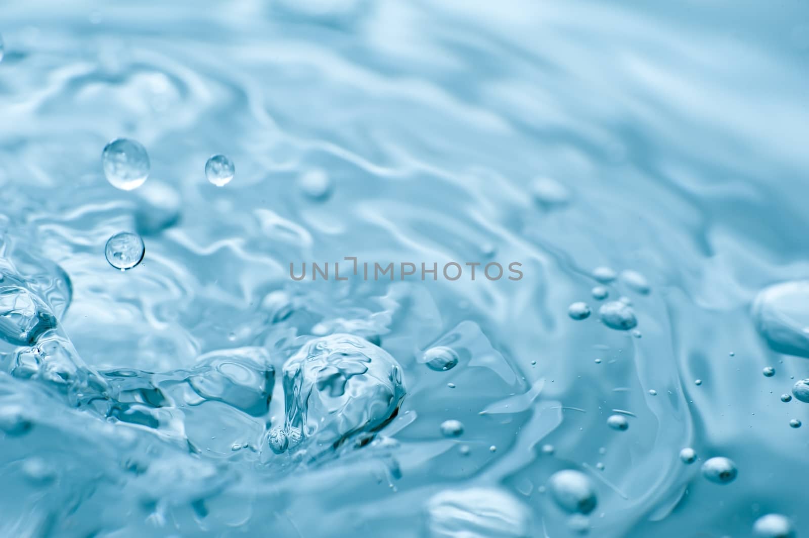 Blue Water Splash Background - Water in Macro Photography. Horizontal Photo.