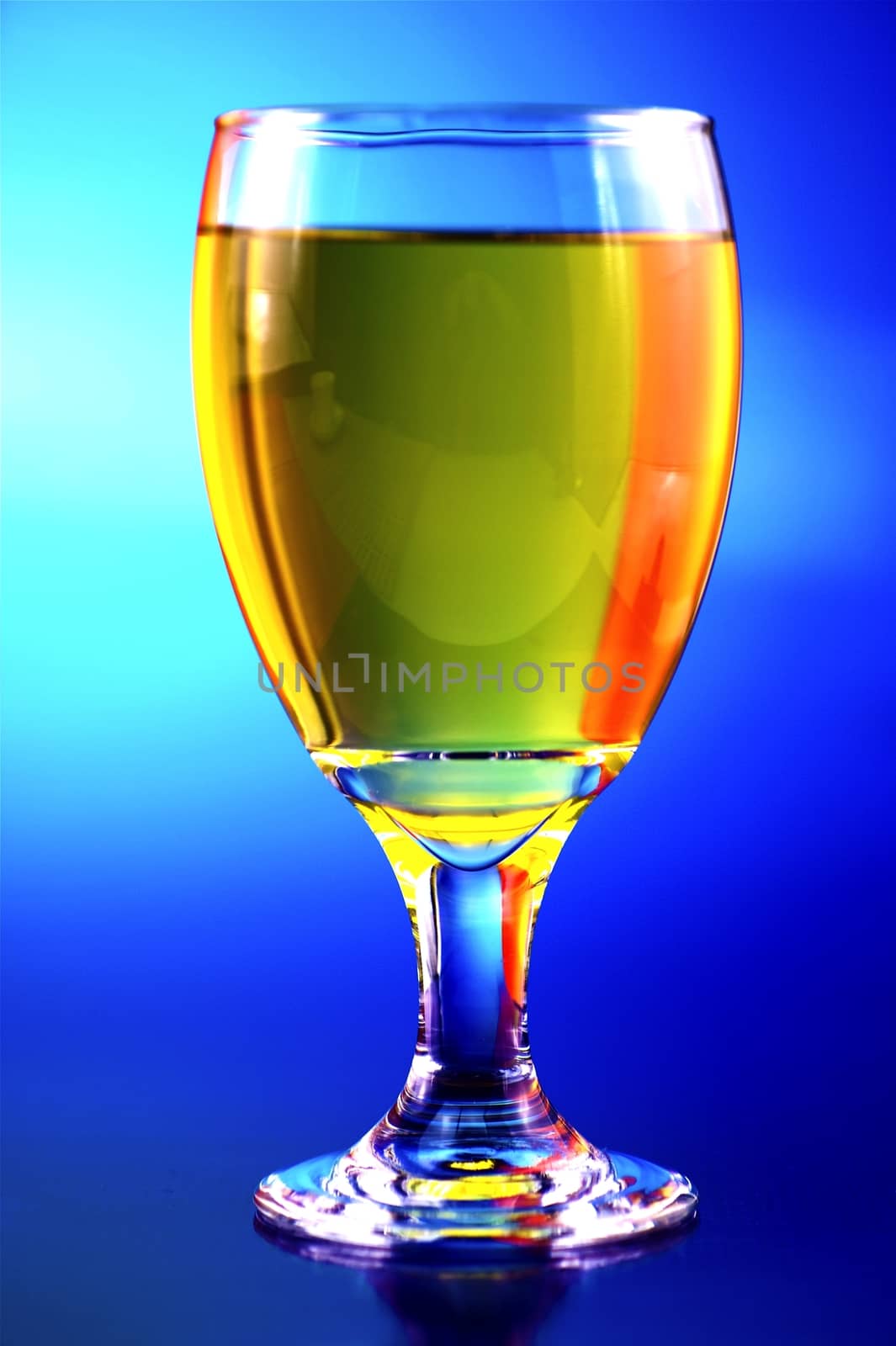 Cold Ice Tea. Clear Glass and Blue Background.