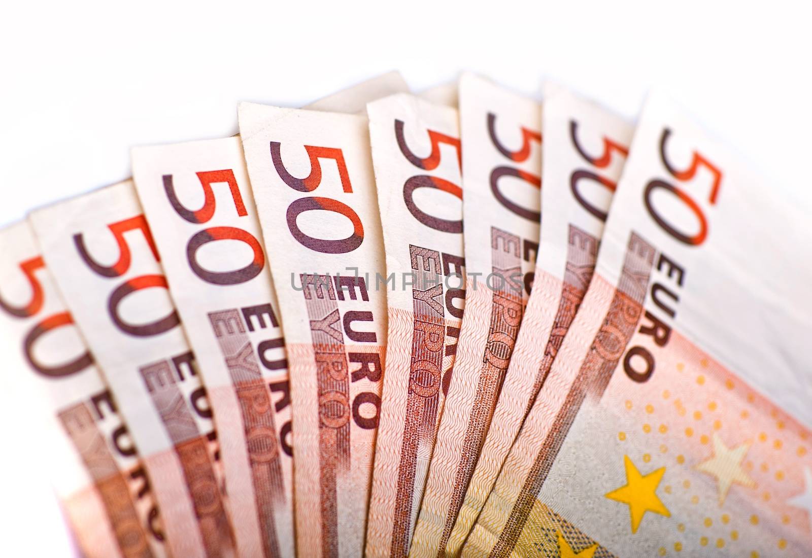 Fifty Euros Pile. European Union Currency. 50 Euro Bills Pile Isolated on White. Closeup Horizontal Photography