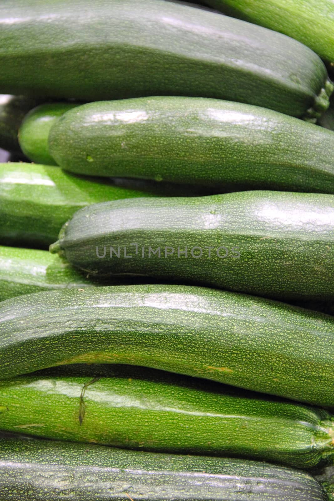 Zucchini pile background healthy food retail concept