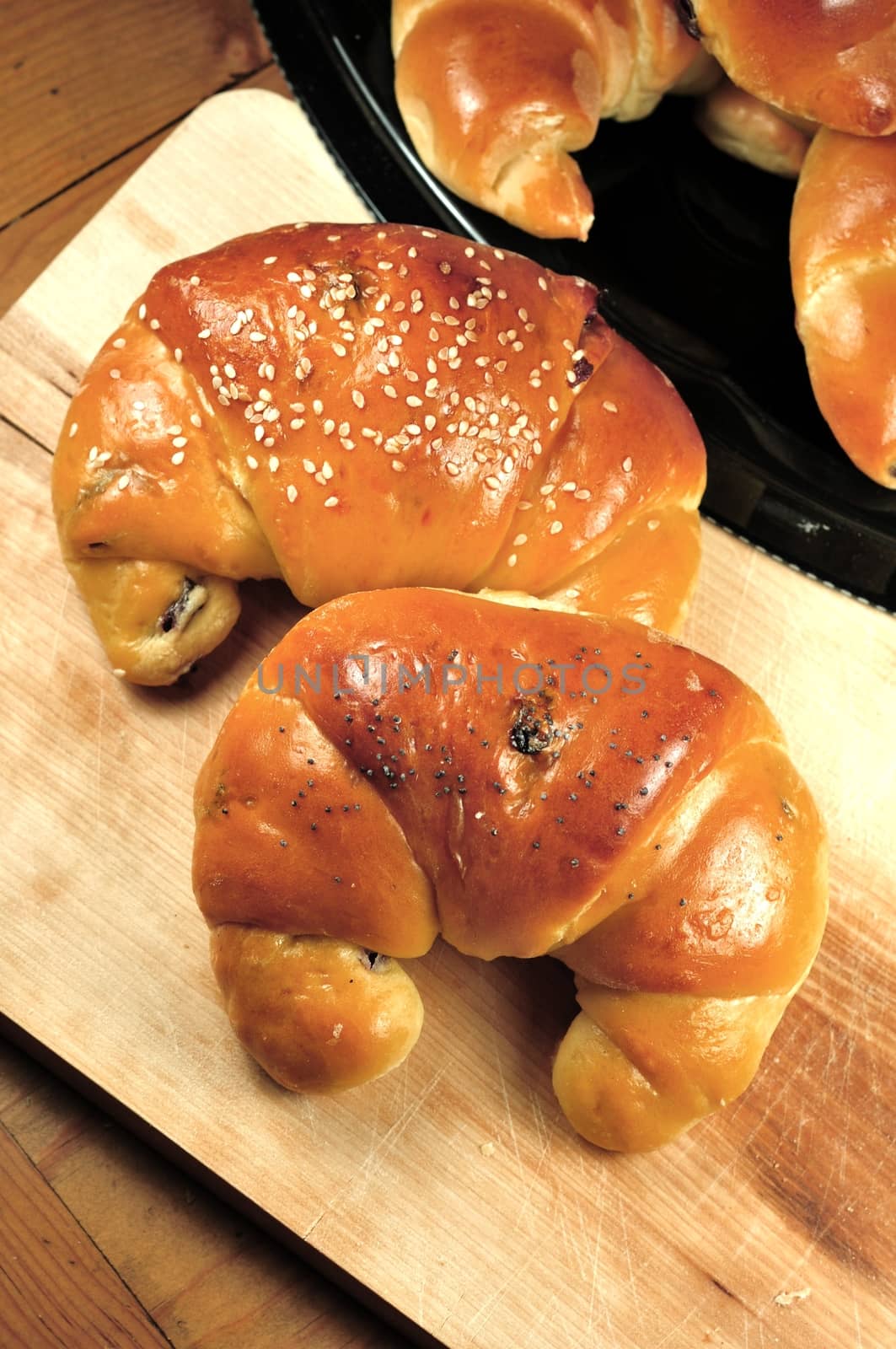 Fresh and Tasty Croissants on the Wood Board and Table. Breakfast Ready.