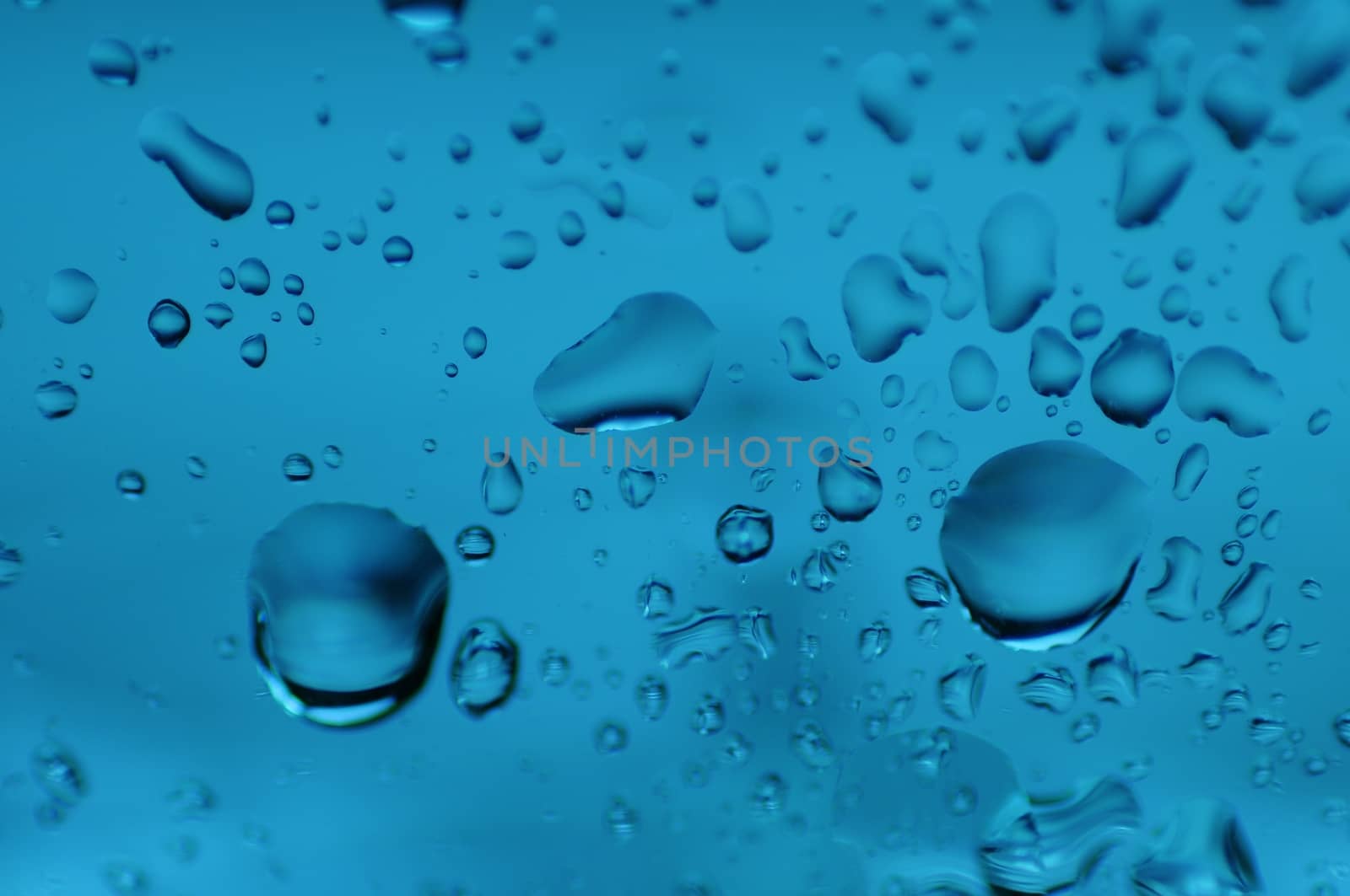Blue Drops on the Glass. Water on the Glass