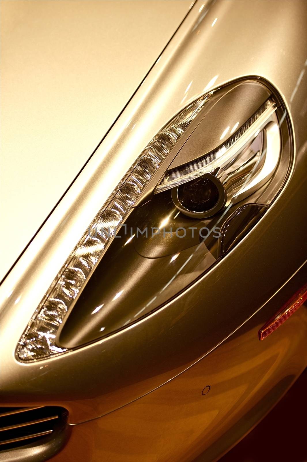 Elegant Luxury Car Headlight Closeup. Expensive Sporty Car Headlight.