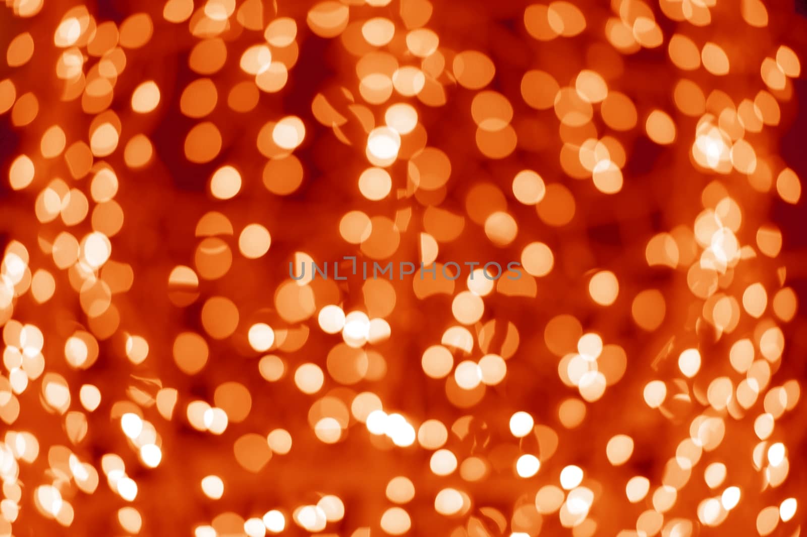 Bokeh Lights - Out of Focus Christmas Lights Background. Red-Orange Holidays Bokeh Lights.