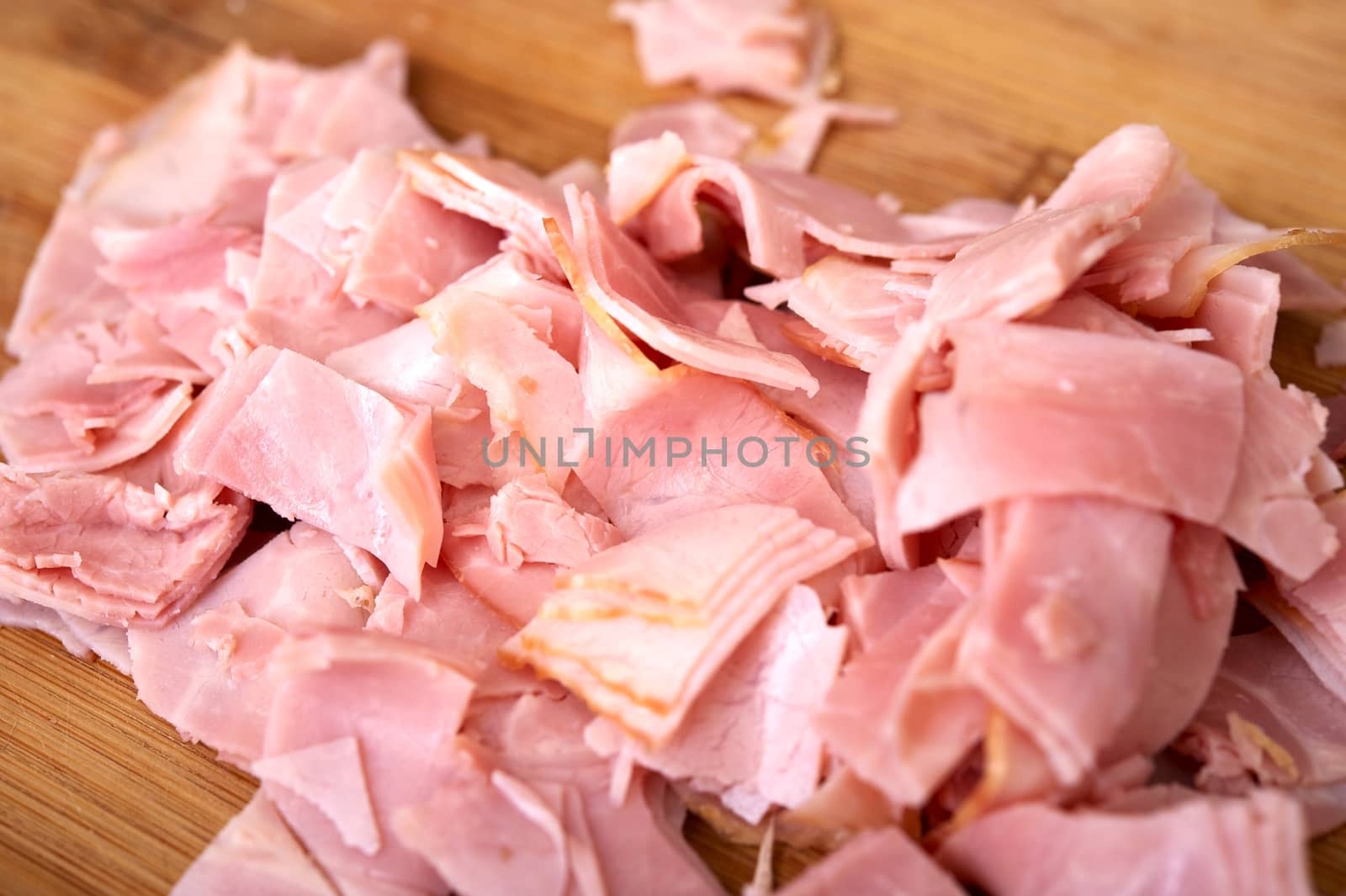 Sliced Fresh Ham on Wood Board. Sliced Ham - Pizza Ingredient
