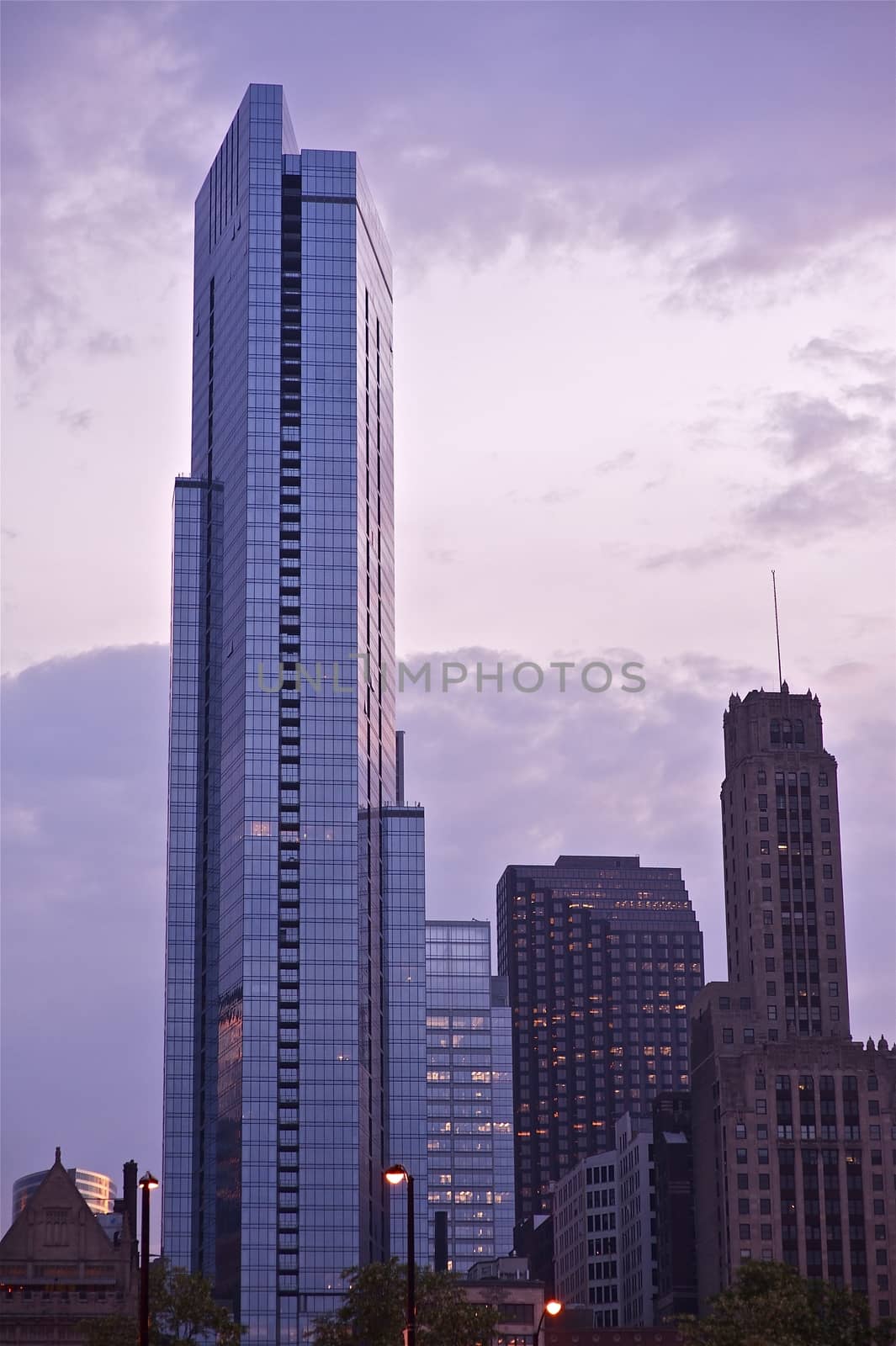 Sunset in Chicago. Warm Colors of the Chicago Downtown. Beautiful Modern Skyscraper - Summer Sunset. Portrait Alignment