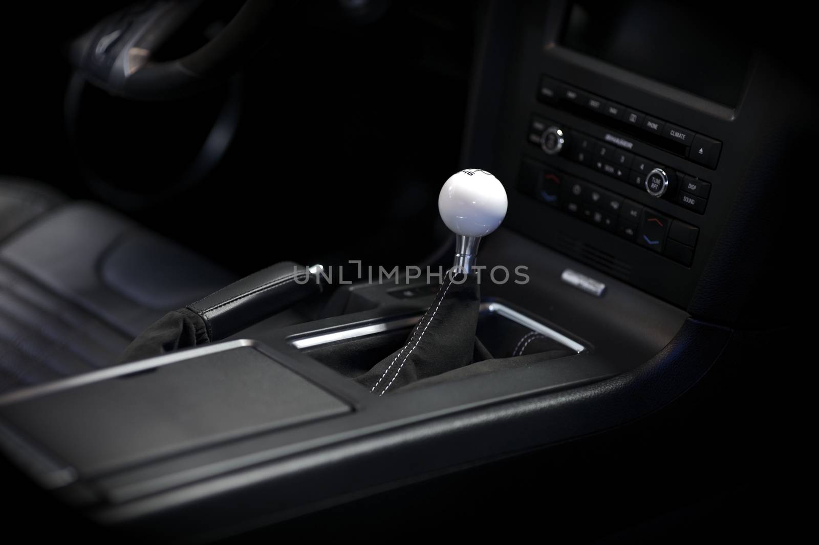 Stick Shift Transmission. Sport Vehicle Interior. Elegant Sport Car Dark Interior with Central Console.