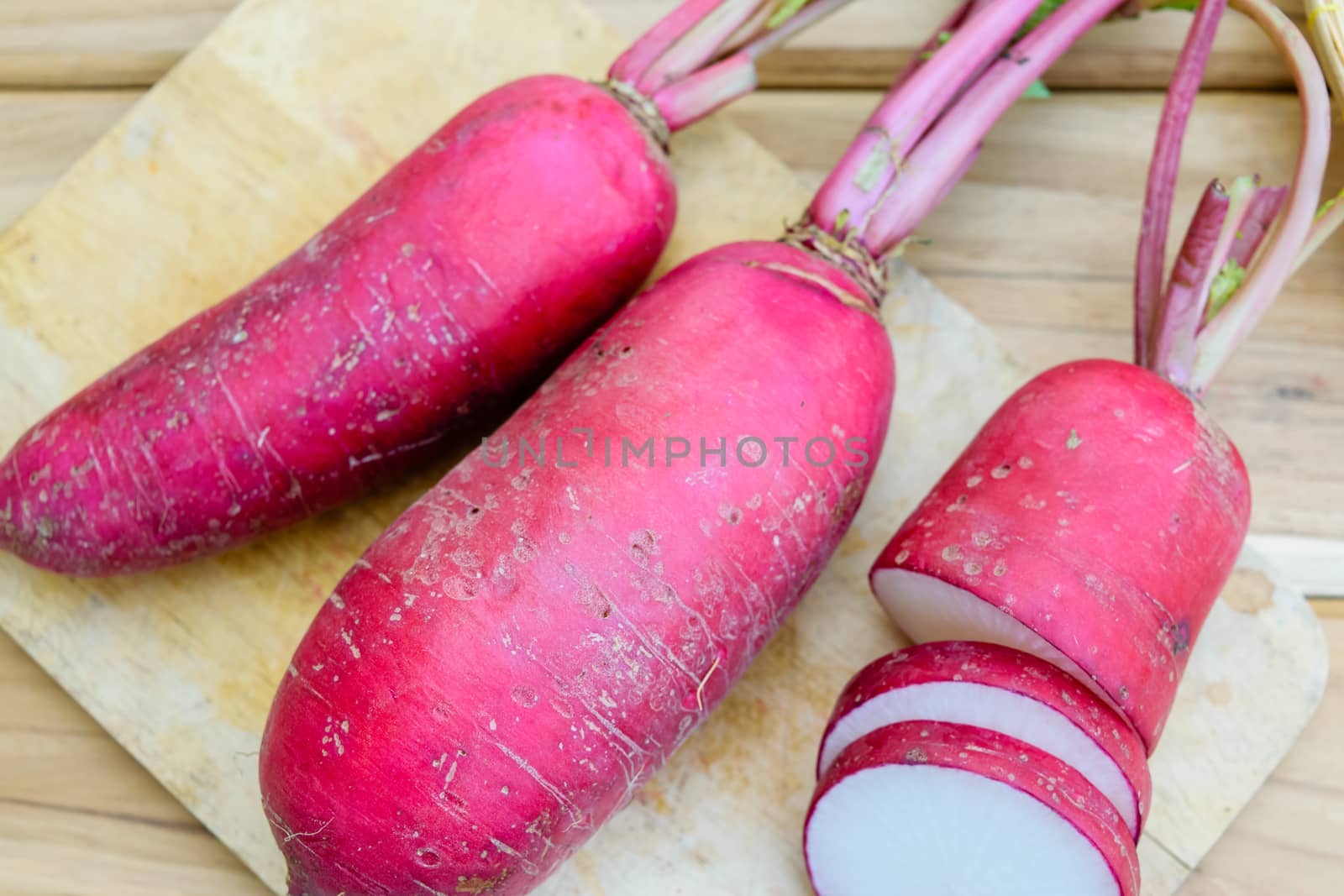 Red radish on wooden table