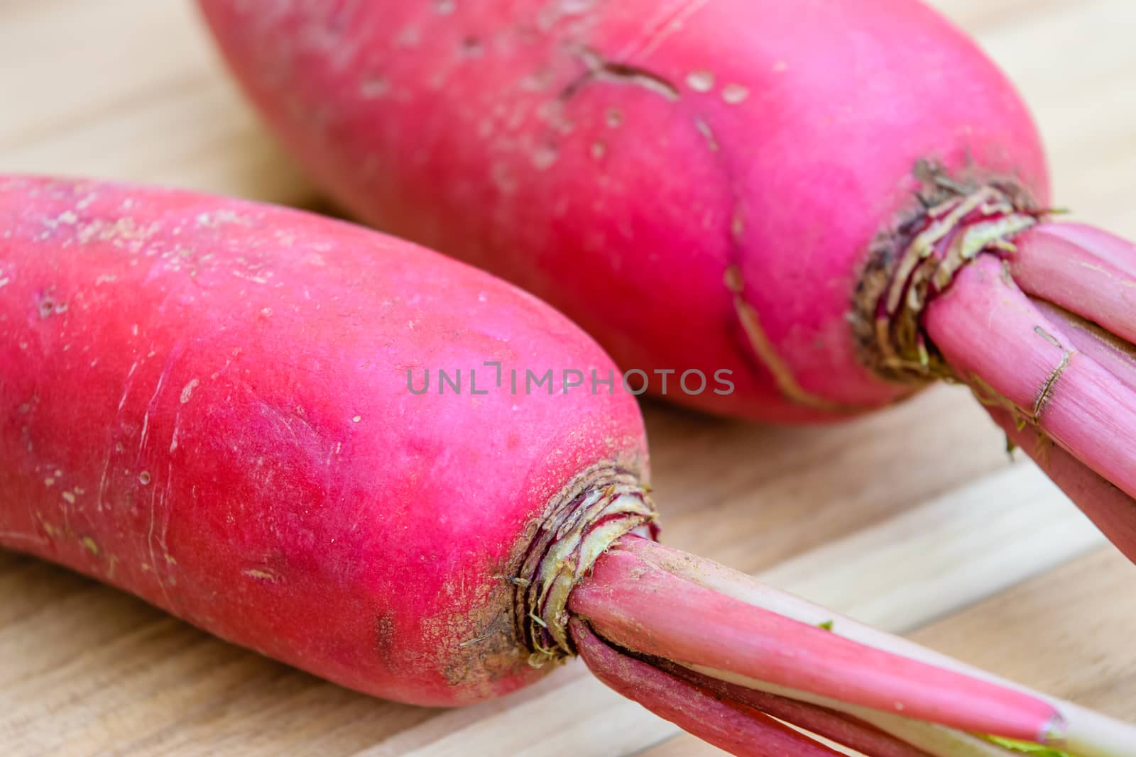 Red radish on wooden table