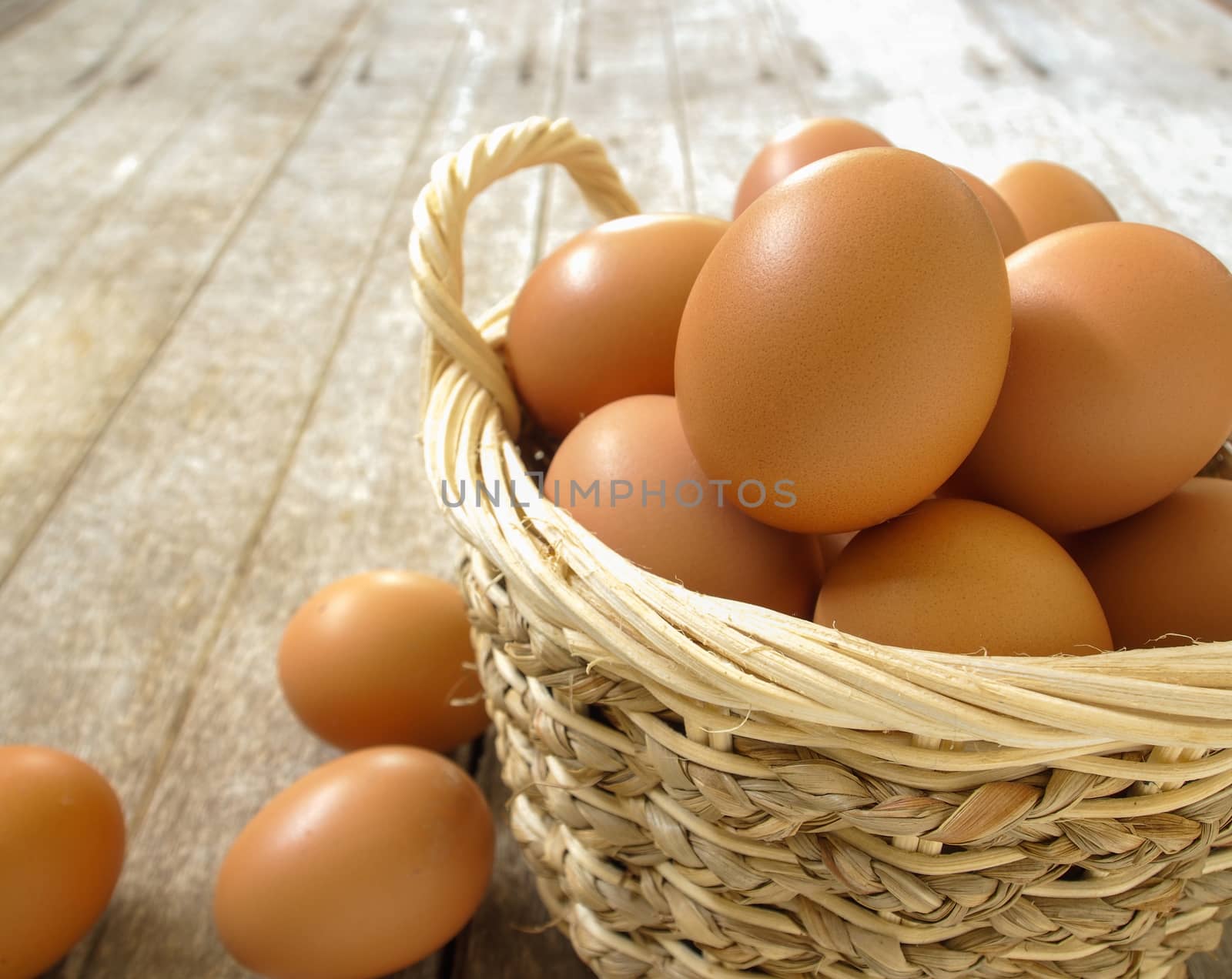 eggs in a basket on a wooden table