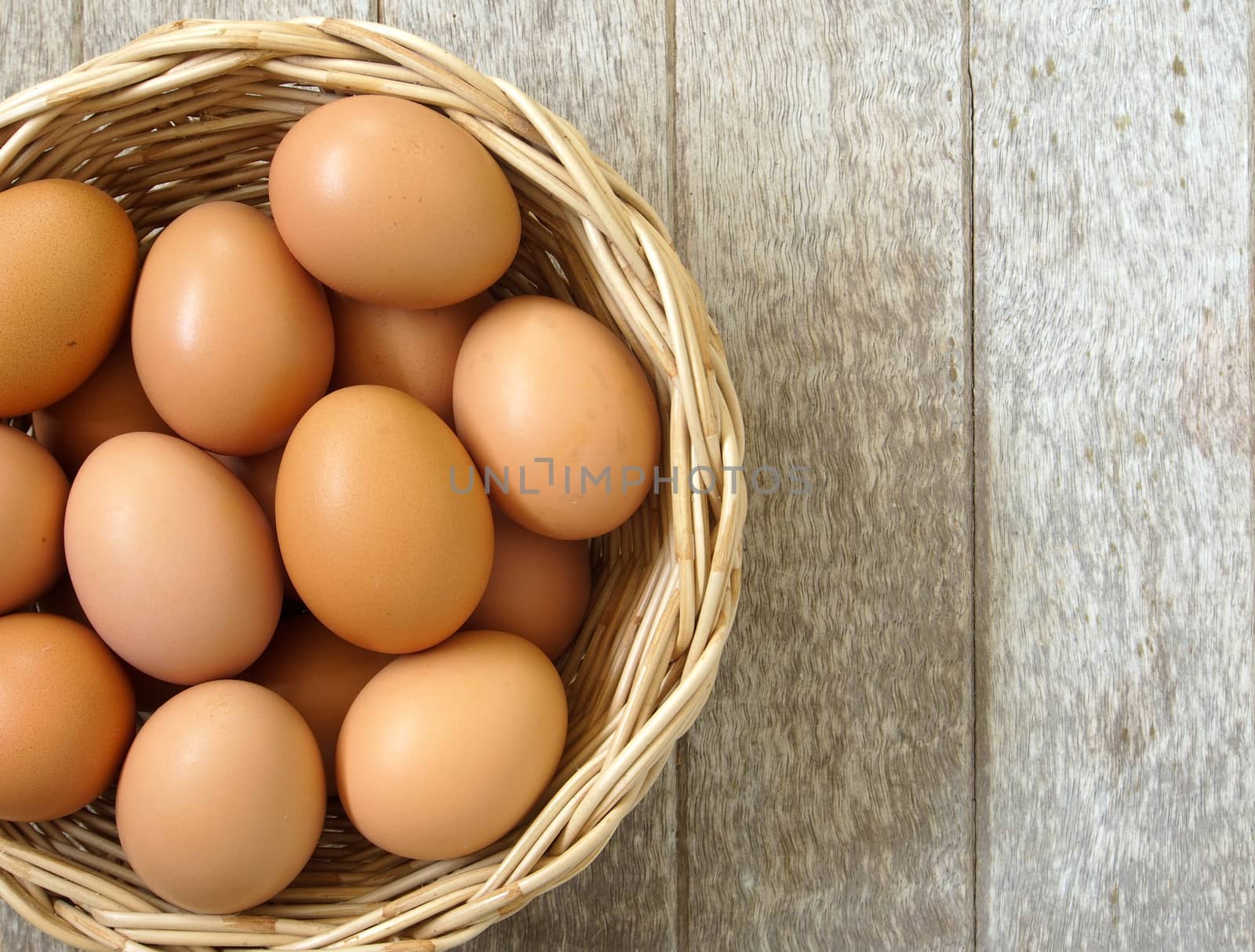 eggs in a basket on a wooden table