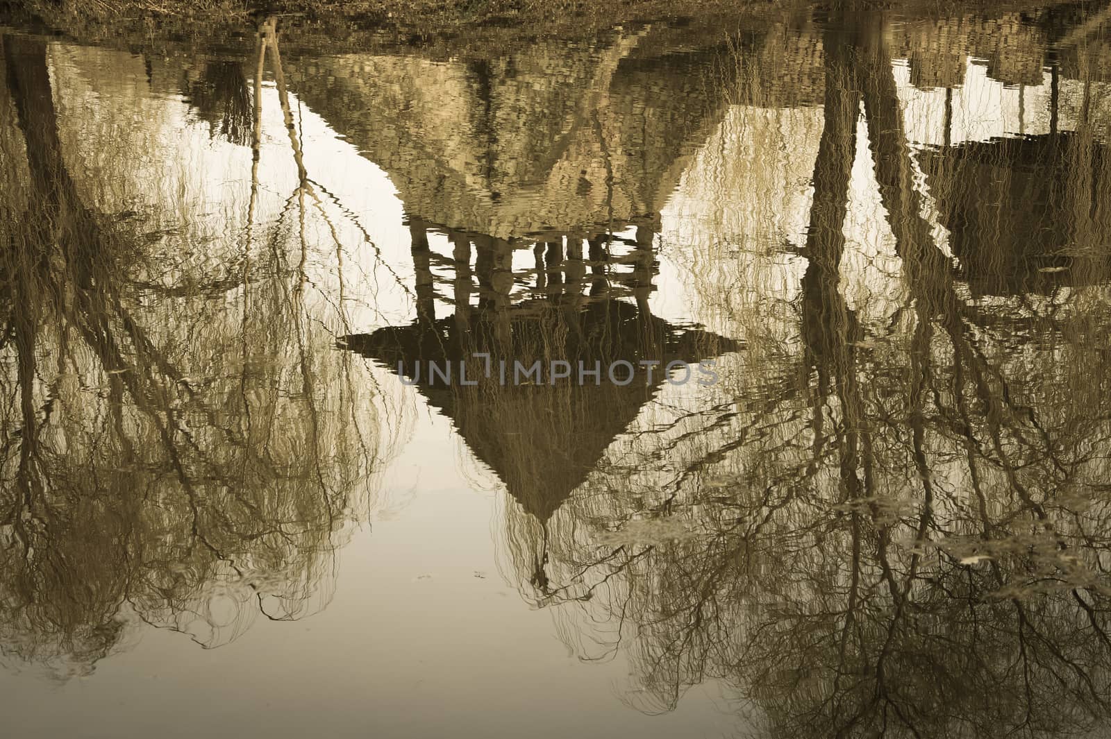 the old castle reflected in water