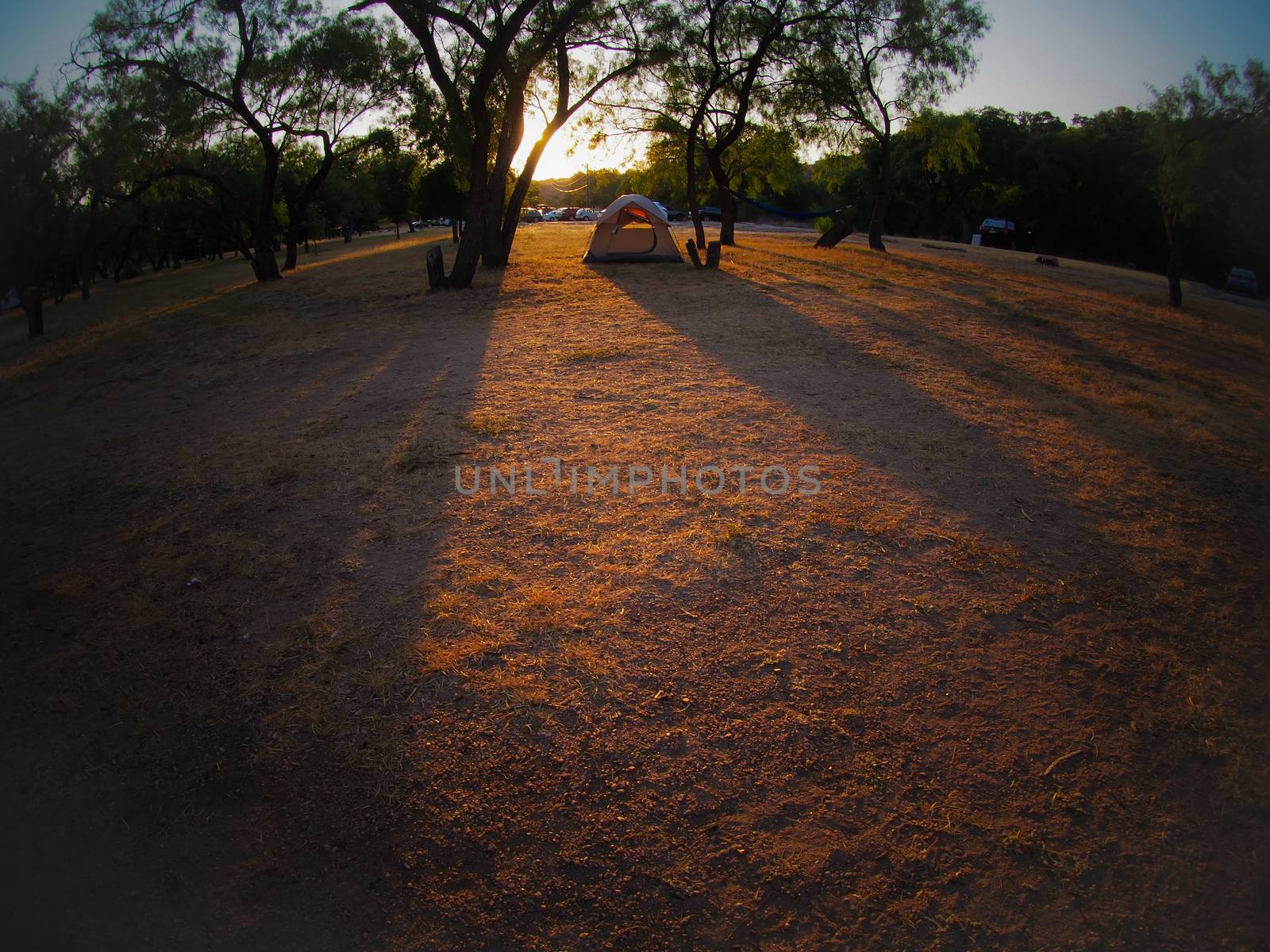 Fisheye view of a tent at sunset at a campsite at Enchanted Rock State Park near Austin, Texas.