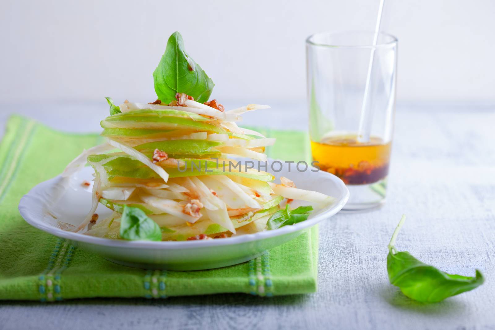 Fresh Fennel and apple salad on a white plate
