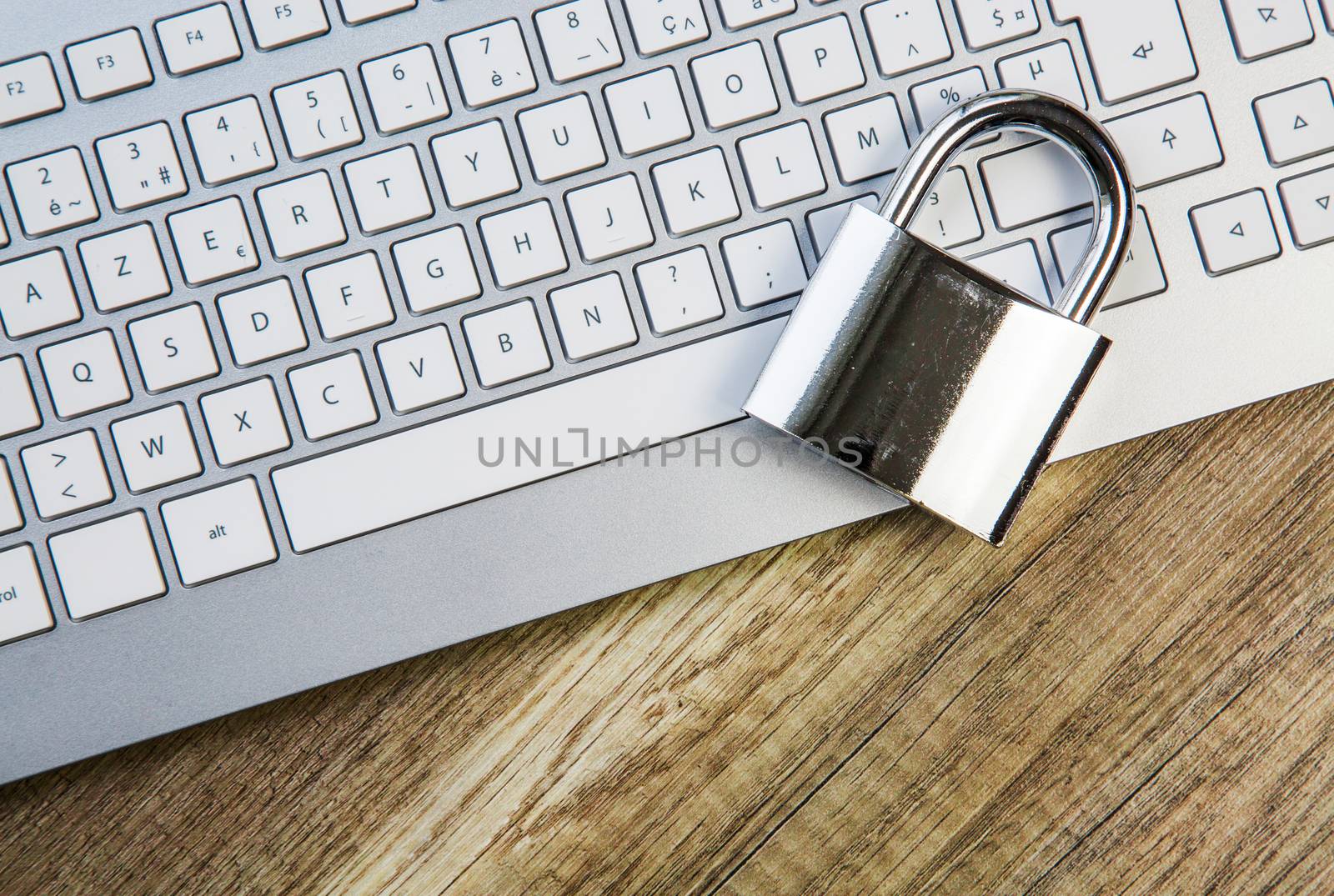 laptop keyboard secured metaphor with padlock